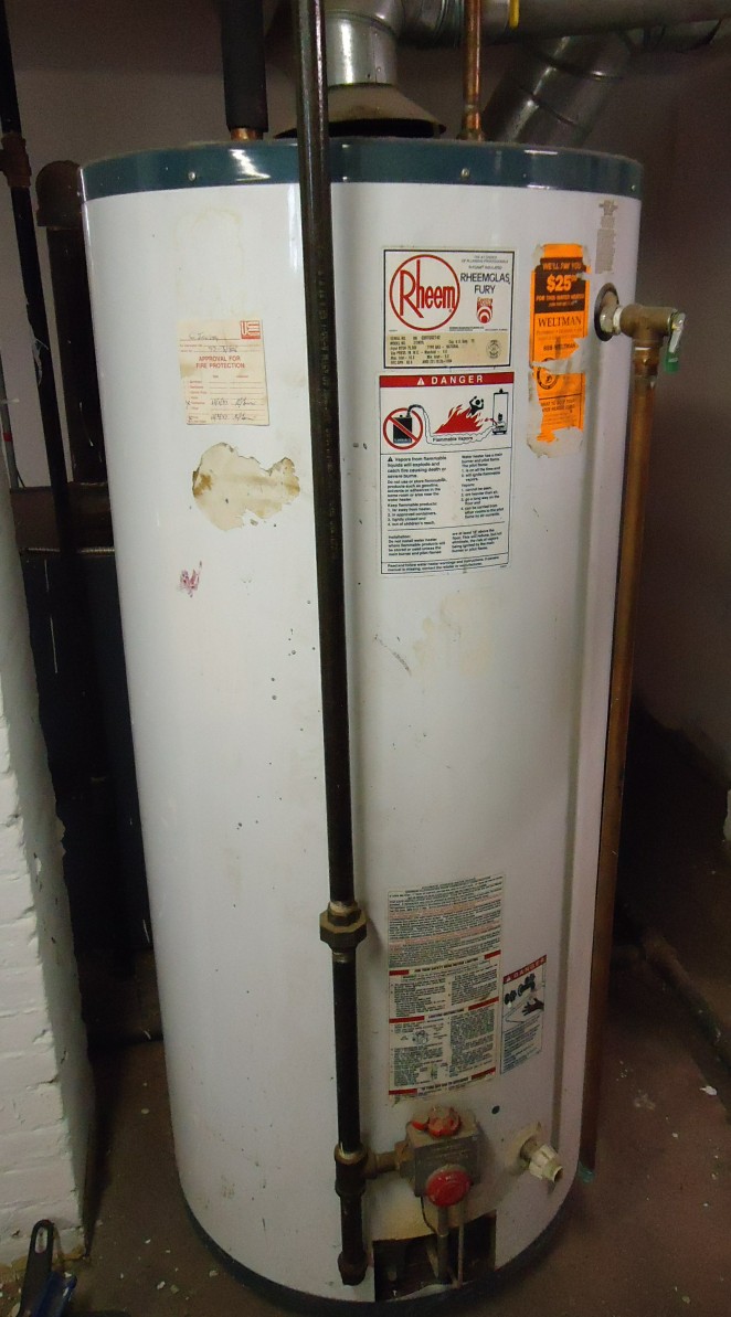 how to flush a water heater tank Residential gas tank water heater showing the tank, pipes, and fittings