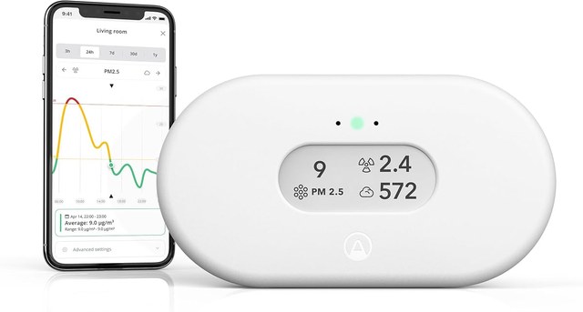Airthings View Plus indoor air quality monitor showing radon, particles, and CO2 on an e-ink display