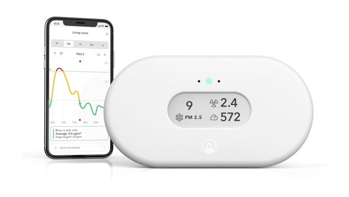An indoor air quality monitor and its companion app showing PM2.5, radon, and CO2 readings